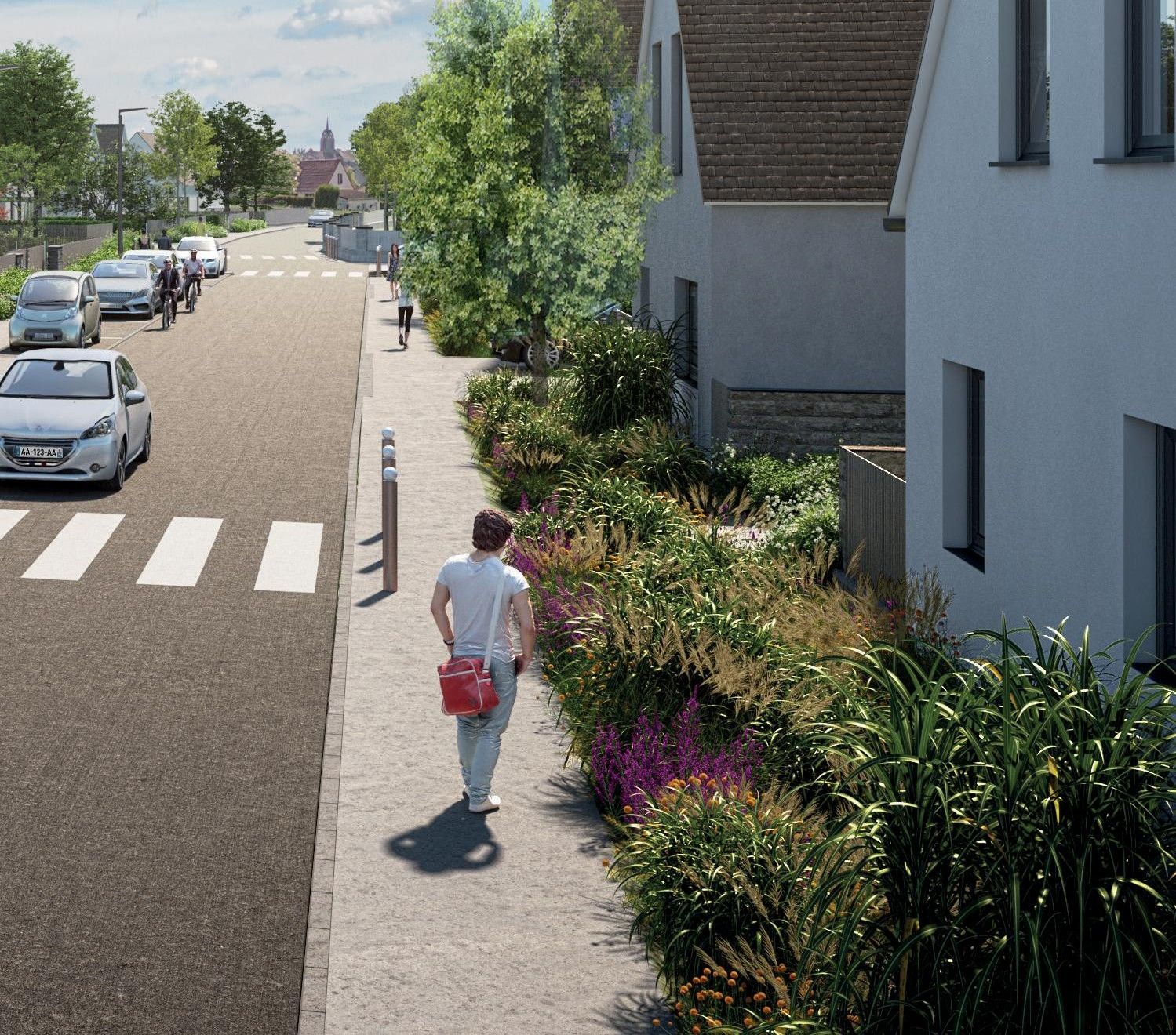 Perspective de la ZAC des Collinettes à Vernou-la-Celle-sur-Seine : une rue du quartier, son trottoir planté et le clocher du village en fond